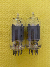 Load image into Gallery viewer, Matched Pair RCA Clear Top 7AU7 Vacuum Tubes Valves NOS NIB 6SN7 Substitute With Adapters