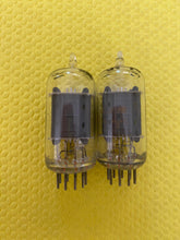 Load image into Gallery viewer, Matched Pair RCA Clear Top 12AU7 12AU7A Vacuum Tubes Valves Steel Support Rods NOS-Testing
