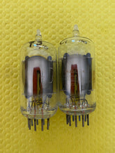 Load image into Gallery viewer, Matched Pair RCA Clear Top 7AU7 Vacuum Tubes Valves NOS NIB 6SN7 Substitute With Adapters
